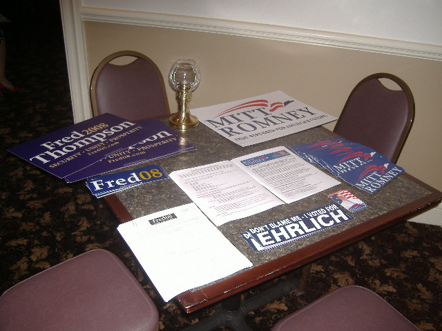 Fred Thompson and Mitt Romney items shared space on this table.